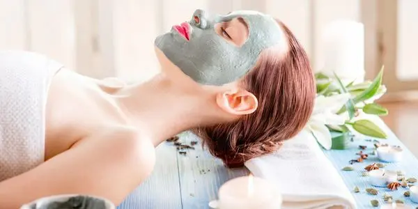 A woman with facial mask on her face.